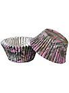 two muffin cups with pink and black designs on them