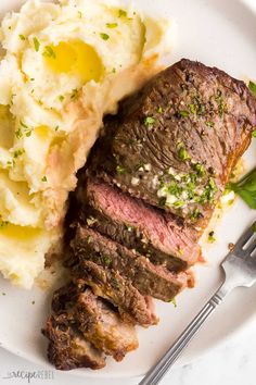 steak and mashed potatoes on a white plate