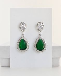 Brilliant & luxurious!! I've created the super sparkly top quality emerald green cubic zirconia teardrop bridal set in gold plated brass setting. The includes : #Earrings feature a large teardrop with pear cut emerald green cubic zirconia center surrounded by tiny round zirconia crystals. Teardrop dangles from a bright cubic zirconia ear stud. Total length of the earrings is 3.5 cms. #Necklace pendant featuring a large teardrop with pear cut emerald green cubic zirconia center surrounded by Glamorous Green Teardrop Jewelry, Green Crystal Bridal Earrings For Formal Occasions, Pear-shaped Emerald Earrings For Wedding, Green Drop Jewelry For Wedding, Formal Green Crystal Bridal Earrings, Emerald Drop Jewelry For Weddings, Emerald Drop Wedding Jewelry, Green Cubic Zirconia Bridal Earrings For Party, Green Cubic Zirconia Bridal Earrings