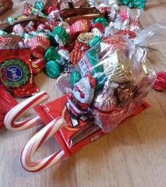 a pile of candy sitting on top of a wooden table