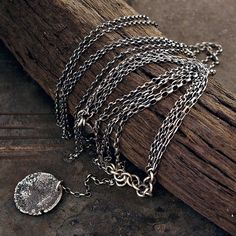 "long multi-strand necklace handmade of oxidized 925 sterling silver, signed, © ewa lompe APPROXIMATE MEASUREMENTS: raw hammered disc size: ~ 22mm chains size: 80 cm or 31.5 \" raw disc + chain size: 8 cm or 3.2\" necklace size: 88 cm or 35\" The item pictured is not the exact ones that you will receive, but it will be the same design. The matching earrings are here: https://www.etsy.com/listing/613432669/use-codes-sale-10-15-20-off-sequins-raw?ref=shop_home_active_14 and here: https://www.etsy. Silver Moon Necklace, Oxidized Silver Necklace, Moon Necklace Silver, Multi Chain Necklace, 2 Necklace, Unique Birthday Gift, Birthday Gift For Women, Celestial Necklace, Disc Pendant