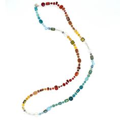 This necklace is made from a gorgeous mix of natural gemstones and Czech glass. Each necklaces is one-of-a-kind and contains carnelian, opalite, red aventurine, ruby jade, turquoise, teal jade and goldstone. Features a sterling silver lobster clasp and chain at the back. This versatile piece can be worn three ways: long, doubled, or as a bracelet. Adjusts from 40 inches to 44 inches long. Multicolor Recycled Glass Beads For Jewelry Making, Bohemian Glass Jewelry With Single Strand, Multicolor Recycled Glass Jewelry For Jewelry Making, Bohemian Single Strand Glass Jewelry, Bohemian Glass Single Strand Jewelry, Multicolor Single Strand Gemstones As A Gift, Multicolor Single Strand Glass Jewelry, Handmade Multicolor Necklaces From Recycled Glass, Handmade Multicolor Necklace From Recycled Glass