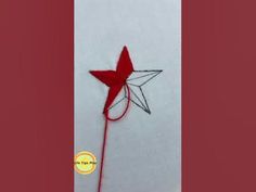 a red and white pinwheel on top of a table