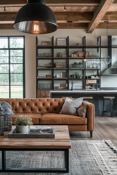 a living room filled with furniture and lots of windows