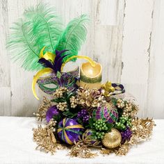 a masquerade with feathers and decorations on a table