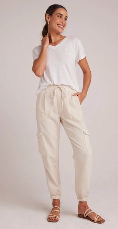 Introducing our versatile Isla Pleated Jogger, designed for both style and comfort, these pants are perfect for everyday wear, offering a comfortable fit that can be worn anywhere. Upgrade your wardrobe with these must-have cargo pants that combine fashion and practicality effortlessly. 50% Cotton 25% Tencel 25% Linen. Everyday Parachute Pants With Side Pockets For Spring, Beige Linen Cargo Bottoms, Relaxed Fit Linen Cargo Bottoms, Relaxed Fit Linen Cargo Style Bottoms, Casual Linen Parachute Pants With Cargo Pockets, Relaxed Fit Cargo Style Joggers For Loungewear, Relaxed Fit Beige Sweatpants With Pockets, Beige Relaxed Fit Sweatpants With Pockets, Linen Cargo Bottoms For Loungewear