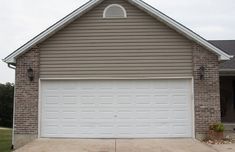 a house with two garage doors on the front