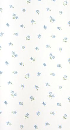 a white wall with blue flowers on it