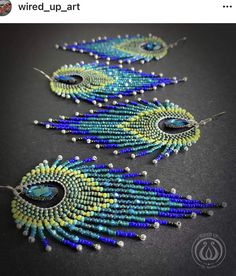 two pairs of beaded earrings with peacock feathers