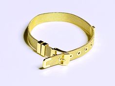 Remember those Gold Belts from the 70's? Well we loved them so much that we decided to bring them back, but as bracelets. These gold plated steel bracelets are adjustable up to 8-1/2 inches, and have a buckle style clasp. So cute and unlike anything else out there!! Adjustable Bracelet With Gold Clasp For Gifts, Adjustable Gold Charm Bracelet For Everyday, Adjustable Bangle Bracelet With Gold Clasp, Adjustable Gold Band Cuff Bracelet, Adjustable Gold Jubilee Cuff Bracelet, Adjustable Gold Cuff Bracelet With Jubilee Detail, Adjustable Gold Cuff Bracelet With Jubilee Style, Adjustable Gold-tone Jubilee Charm Bracelet, Adjustable Gold-tone Charm Bracelet With Jubilee Details