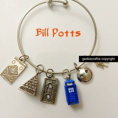 "\"Bill Potts\" is the Doctor's Companion in season 10 of Doctor Who. I made this bracelet to represent her because I think she's AMAZING. EASILY in my top 3 favorite companions of all time.  Antique silver, adjustable bangle.  Limited supply. If you have any , please send me a message! I'm happy to answer questions. I'm always willing to personalize items, with enough time allowed to do so.  Please check out the other fandom-inspired items in my shop! https://www.etsy.com/shop/geekiecraftie Tha Doctor Who Charm Bracelet, Bill Potts, My Top 3, Shes Amazing, Adjustable Bangle, Inspired Jewelry, Last Minute Gifts, Doctor Who, One Pic