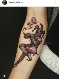 a person with a tattoo on their arm