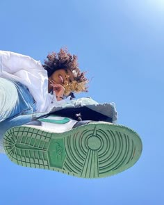 a person with their feet up in the air