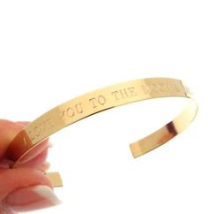 Gold Inspirational Cuff Bracelet, Personalized Gold Bracelet, Engraved Bracelet custom, Birthday Gift for her Gold Name Bracelet, Valentine's Day gift for women A beautiful addition to a daily wardrobe, this classic, simple, elegant gold cuff bracelet will never go out of style. The design includes custom engraved initials, text, Roman numerals, date, monogram, quote or any words you want. The personalized bracelet would be a nice gift for any occasion. Adjustable You can bend the cuff a little Adjustable Gold Bangle Bracelet For Anniversary, Gold Bangle Cuff Bracelet For Anniversary, Gold Cuff Bangle Bracelet For Anniversary, Adjustable Gold Band Cuff Bracelet, Gold Engraved Cuff Jewelry, Gold Engraved Bracelet As A Gift For Her, Personalized Jewelry Band For Gift, Personalized Band Jewelry For Gift, Personalized Band Bracelet For Gift