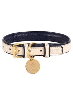 a white and blue leather dog collar with a gold - plated star on the front