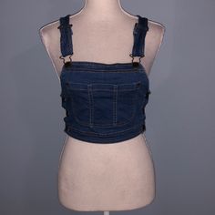 New With Tags Denim Crop Top By Mebon By Machine Jeans. Size Medium. Has Pocket On Front. Buttons On Side. Has Adjustable Straps. Stretches Some. About 14.5” Across And 16” From Top Of Shoulder To Bottom. Cropped Blue Denim Vest With Pockets, Trendy Cropped Dark Wash Denim Top, Trendy Cropped Blue Denim Vest, Blue Denim Vest For Day Out, Trendy Blue Denim Top, Maroon Crop Top, Cold Shoulder Crop Top, Bodice Top, Denim Crop Top