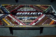 a coffee table made out of hockey stickers on top of carpeted flooring