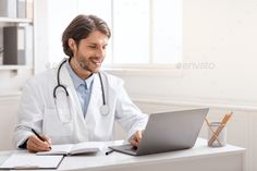 a male doctor working on his laptop computer