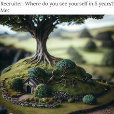 there is a miniature tree on top of a small hill with a house in it