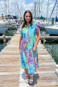 This multicolor printed dress features a collared neckline, smock detailed shoulders, frilled short sleeves, front button-up closure, side pockets, tiered, lined, and midi length. 50% Cotton 50% Rayon Hand Wash Cold. Do Not Wring Or Twist. Non Chlorine Bleach Only. Hang Dry. Low Iron As Needed. May Be Dry Cleaned. Madison is 5’8“ wearing a size Small.Model measurements:Bust: 32 in.Waist: 24 in.Hip: 34 In. Frill Shorts, Low Iron, Printed Midi Dress, Printed Dress, Model Measurements, No Frills, Midi Length, Smocking, Bleach