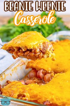 a casserole dish with beans, cheese and meat is being lifted from the casserole