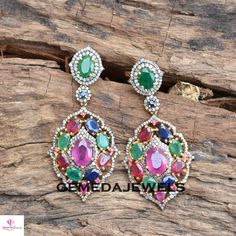 Ruby Gemstone Earrings, Emerald Silver Earrings, Pave Diamond Earrings, Sapphire Gemstone Jewelry, 925 Silver Gold Plated Jewelry, Gifts Gross Weight: 16.32 gram Gemstone Weight: 16.87 cts Diamond Weight: 1.90 cts Earrings Size: 54X26 MM NOTE:- All The Products Are Designed And Manufactured In My Workshop By Me & My Team. Shown Products Are Purely Handmade. Custom Orders Are Open Handly Accepted. We Are the Perfect Choice For Any Custom Jewelry Manufacturing. For Bulk Orders Please Message m Formal Multi-stone Drop Earrings, Multicolor Diamond Round Earrings, Multicolor Round Diamond Earrings, Formal Stone Drop Earrings, Formal Drop Earrings With Stones, Formal Multicolor Gemstone Earrings, Multicolor Round Earrings With Stones, Formal Multi-stone Cubic Zirconia Earrings, Fine Jewelry Stone Earrings For Weddings