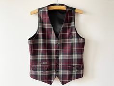 "Vintage Plaid wool silk blend men's vest, Classic waistcoat, warm formal men winter vest, Steampunk vest, gentlemen's outfit, size medium vest Measurements (lying flat): Length: 26\" Pit to pit: 20\" Please check measurements to insure a proper fit. Remember to allow yourself some extra room for movement. You can compare these with something from your closet that fits you well. Condition: Great Vintage Condition Material: wool, poly, silk SHIPPING * I ship worldwide via Priority mail. * I ship from Europe, so please allow 2 to 4 weeks for the package to arrive if you live overseas. * Europe 5 - 10 business days. Go back to my shop: YourEclecticStreet.etsy.com P.S. why buy Vintage? - Vintage is Unique! - Vintage is Eco Friendly! - Vintage is Inspirational! - Vintage is History! - Vintage i Business Wool Sleeveless Vest, Formal Winter Sleeveless Vest, Formal Sleeveless Winter Vest, Formal Sleeveless Fall Vest, Business Vest For Fall, Sleeveless, Fall Business Vest Sleeveless, Wool Sleeveless Vest For Winter, Winter Formal Vest For Business, Winter Sleeveless Wool Vest