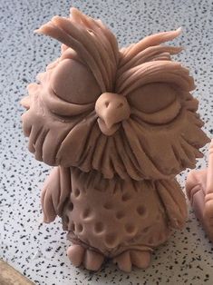 an owl figurine sitting on top of a counter