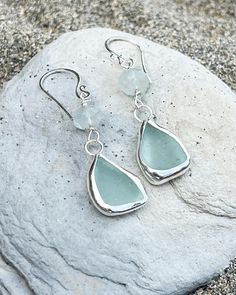 These Cornish sea glass earrings were made by me, using eco friendly (recycled) silver and beautifully smooth sea glass found on my local beach on the south coast of Cornwall near Fowey.  Pair 1: Aqua seaglass and moonstone (approx 5cm long) Pair 2: light sage green sea glass and flashy labradorite (approx 4.5cm long) Pair3: aqua sea glass and Iolite (approx 4.5cm long)  All my jewellery is sent out beautifully wrapped and boxed in my branded packaging :) Handmade Silver Sea Glass Earrings, Handmade Silver Earrings With Sea Glass, Silver Hypoallergenic Sea Glass Earrings, Silver Teardrop Sea Glass Jewelry, Silver Hypoallergenic Earrings With Sea Glass, Hypoallergenic Silver Sea Glass Earrings, Silver Sea Glass Dangle Earrings, Seaglass Earring, Light Sage Green