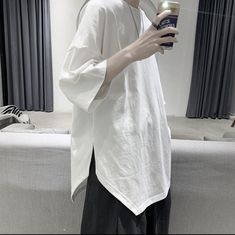 Oversized Cotton Tops With Asymmetrical Hem, Oversized Cotton Top With Asymmetrical Hem, Casual Cotton Shirt With Asymmetrical Hem, Casual Shirt With Relaxed Fit And Asymmetrical Hem, Casual Shirt With Asymmetrical Hem And Relaxed Fit, White Cotton Shirt With Asymmetrical Hem, White Casual Top With Asymmetrical Hem, Casual White Shirt With Asymmetrical Hem, Cotton T-shirt With Asymmetrical Hem For Summer