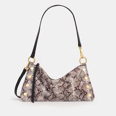 This fresh, of-the-moment bag is entering the chat as a must-have companion for nights on the town. Featuring a slouchy but current shape, this versatile little number transitions from a wristlet to a shoulder bag in seconds flat. The Kyle also includes a removable and adjustable crossbody strap, so you can go hands-free - and carry a couple of cocktails. Our Contrast Snake Collection features Italian leather with snake scales delicately foiled onto a luxurious suede base, creating a fusion of t Fall Handbag Trends, Snake Scales, Fall Handbags, Brown Tones, Trending Handbag, Deep Brown, Fall Fashion Trends, Scarf Jewelry, Leather Care