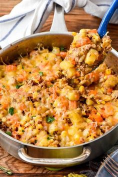 a large pot filled with food on top of a wooden table