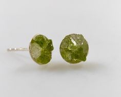 Peridot and Crystal Quartz chip, small Sterling Silver stud earrings.  The entire base and posts of the earring are Sterling Silver. They measure 8mm. Petite tiny, spring green dots of gemstones. The earrings are natural Peridot chips with a little sprinkle of Crystal Quartz and vary slightly in the composition of the stones, each one is a unique piece. Chip Earrings, Raw Gemstone Jewelry, Small Stud Earrings, Small Boho, Small Earrings Studs, Green Peridot, Jewelry Sterling Silver, Quartz Earrings, Raw Gemstones