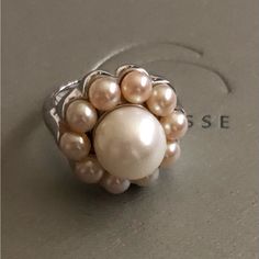 This Is A Lovely Dinner Ring That Was Worn Once. It Was Made By Tiffany & Co. For Its Irridesse Boutique Which Sold Pearl Jewelry. There Is A Large White Pearl In The Center Surrounded By Pale Pink Pearls. It Is A Beautiful Statement Ring! Dinner Ring, Pink Pearls, Pink Pearl, Pearl Ring, White Pearl, Large White, Womens Jewelry Rings, Statement Ring, Tiffany & Co.