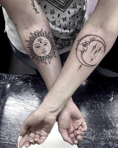 two sun and moon tattoos on both arms