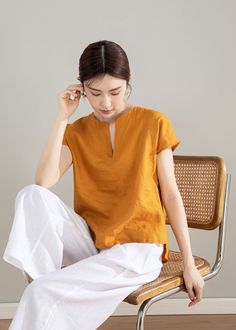 "This yellow short sleeve linen top is made of 100% natural linen fabric. It's comfortable and lightweight, making it perfect for wearing in hot weather. The bright color of the top makes it a perfect match for spring and summer. DETAILS * 100% linen tops * Loose fit tops * Short sleeve tops * Summer linen top * Wash by hand or machine with cold water, Ironing after dry   * The model is 168cm (5′ 6″) tall with a 80cm (31.5\") bust, 66cm (26\") waist. She is wearing a XS. * Choose CUSTOM Order if you Can't find your size in our size Chart Chang the Length Your Height is not Between 5'1\" - 5\"9\" Your weight is not Between 47 kg - 75 kg SIZE GUIDE Size vary between Brand and Country Please get your body measurement with our Size Guide And Find your size in our Size Chart SIZE CHART https:// Casual Flax Blouse For Summer, Solid Ramie Tops For Spring, Yellow Linen Summer Tops, Yellow Linen Tops For Spring, Flax Short Sleeve Summer Blouse, Flax Short Sleeve Top For Summer, Summer Flax Blouse With Short Sleeves, Short Sleeve Flax Top For Summer, Casual Yellow Linen Blouse