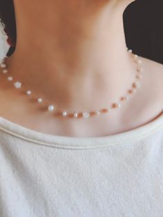 Next day shipping Small natural pearls and stars carved from shells form a very simple and cute little necklace for daily wear. * Material: High Quality Natual pearl and shell * The necklace is adjustable from 15.5  to 17.5 inches. Please don't hesitate to contact me with any questions at all. View more items in my shop      https://www.etsy.com/shop/TTanGadgets TTANGADGETS copyrights all images. All rights reserved White Minimalist Crystal Necklace With Clavicle Chain, White Star-shaped Clavicle Chain Necklace, White Crystal Necklace With Pearl Charm As Gift, White Round Beads Crystal Necklace Minimalist Style, Minimalist White Crystal Necklaces With Round Beads, White Pearl Jewelry With Star Charm, Minimalist White Crystal Necklace With Round Beads, White Star-shaped Jewelry With Clavicle Chain, Handmade White Star Beaded Necklaces