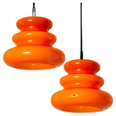 two orange lights hanging from the ceiling