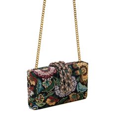 Immerse yourself in the lush elegance of the Bagh Braided Fringe Clutch, a breathtaking masterpiece from our Anar Edit collection. 'Bagh' translates to 'garden' in Hindi, and this clutch embodies the essence of strolling through an enchanting botanical garden. Crafted from rich woven jacquard fabric in deep green, adorned with intricate flora and fauna, this piece is a celebration of nature's artistry. The braided crystal closure clasp adds a touch of sparkle, reminiscent of dew-kissed flowers. Simitri Styling Tips: Perfect for vacations, galas, and every exquisite event in between, the Bagh Braided Fringe transforms any outfit into a statement of refined luxury. Pair it with a flowy summer dress for a garden party or elevate your evening attire with its lush, inviting charm. Composition C Luxury Multicolor Clutch, Elegant Multicolor Evening Bag, Elegant Multicolor Evening Clutch, Luxury Multicolor Rectangular Clutch, Elegant Multicolor Clutch For Formal Occasions, Elegant Multicolor Clutch For Events, Elegant Multicolor Evening Bag For Formal Occasions, Elegant Multicolor Formal Bags, Handmade Multicolor Evening Bag For Formal Occasions