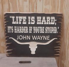 John Wayne Rustic/Wood/Sign/Cabin/Lodge/Western/Cowgirl/Cowboy/Old West/Bunkhouse/décor Life is hard, it's harder if you're stupid. Great addition to your western décor to give folks a chuckle! Great gift for the John Wayne fans! The words are carved into the wood. This sign measures approx. 11.25" x 14". Saw tooth hanger on back for easy hanging. Props/background NOT included, you are purchasing the sign only. John Wayne Decor, Western Signs For Bedroom, Western Bathroom Signs, Western Porch Ideas, Western Airbnb, Western Home Decor Diy, Western Diy Decor, Western Cabin Decor, Western Decor Bedroom