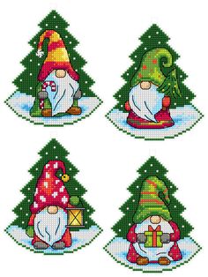 four gnomes are sitting in front of christmas trees