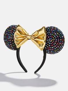 Embrace your inner Minnie Mouse with the Minnie Mouse Disney Multicolored Gem Ears Headband. These ears are accessorized with multicolored stones and a big gold bow. Wear this headband to anything from birthday and costume parties to your Disney vacations. This is an officially licensed Disney product. Mickey Mouse Ears Headband, Disney Minnie Mouse Ears, Disney Ears Headband, Harry Potter Shop, Minnie Mouse Ears Headband, Disney Bows, Mickey Balloons, Mouse Ears Headband, Disney Birthday