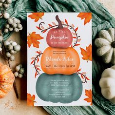 a pumpkin themed baby shower is on the table next to fall leaves and white pumpkins