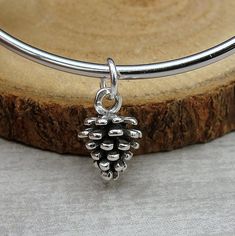 "This Pine Cone Charm comes with a silver jump-ring as pictured. Please note that photo is not to scale and may appear larger to show detail. Refer to exact measurements below. Additional attachments (lobster clasp, large-hole bead, necklace chains) are available from the charm-attachments drop-down menu.  For a visual example of the different attachments and what each one is best suited for, scroll through the photos until you see the example photo or visit https://etsy.me/2BY7DAW for detailed Nickel Free Sterling Silver Christmas Jewelry, Nickel-free Sterling Silver Christmas Jewelry, Nickel-free Sterling Silver Jewelry For Christmas, Adjustable Sterling Silver Christmas Jewelry, Sterling Silver Dangle Jewelry For Christmas, Adjustable Silver Jewelry For Christmas, Silver Charm Bracelet For Christmas Gift, Silver Christmas Charm Bracelet Gift, Christmas Silver Charm Bracelet Gift