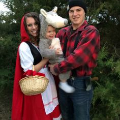 a man, woman and child are dressed up as the little red riding hood character