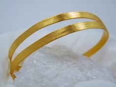 Eleganc gold  - the effect I was looking when I created this jewelry.Beautiful and flattering bangle that adds a touch of gold and elegance to your evening wear.This bangle is matt-brush finish  which gives the jewelry elegant and luxurious look .For you -  hammered texture Lovers - can also order hammered finish (matte or glossy) Specify while orderingYou can see diffrent finish variasions in 5th pictureThe model is wearing three bangles - two matt finish and one hammered-shiny  *** Extremely b Gold Double Band Bracelets For Formal Occasions, Gold Double Band Bracelet For Formal Occasions, Gold Minimalist Bangle For Formal Occasions, Elegant Double Band Gold Bracelets, Elegant Gold Double Band Cuff Bracelet, Elegant Double Band Gold Cuff Bracelet, Gold Double Band Bangle As A Gift, Elegant Matte Gold Bracelets For Formal Occasions, Gold Bangle Bracelet For Evening