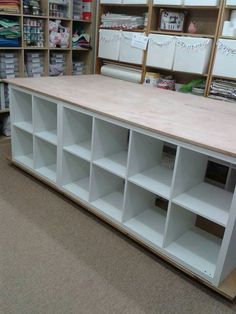 the shelves are empty and ready to be used in this craft shop or storeroom