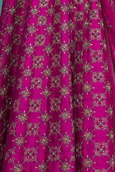 Magenta embroidered lehenga in metallic thread, glass beads and pearl work. Paired with an floral embroidered blouse and dupatta.
Components:3
Pattern:Hand embroidered
Type of Work:Metallic thread work, Glass beads, Sequins, Cutdana work
Neckline:Sweetheart
Sleeve Length:Short sleeves
Fabric:Raw silk, Net
Color:Pink
Other Details:
Bead work cuff blouse
Tie up back blouse
Occasion:Wedding, Reception - Aza Fashions Traditional Embellished Pre-draped Saree In Raw Silk, Festive Pre-draped Saree With Motifs For Reception, Festive Floor-length Sets With Motifs, Embellished Art Silk Lehenga For Wedding, Silk Thread Sets For Reception On Eid, Sharara With Motifs For Diwali Reception, Diwali Reception Sets With Motifs, Festive Sets With Motifs For Reception, Embellished Art Silk Anarkali Set For Navratri