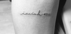 a woman's arm with a tattoo that reads elizabeth