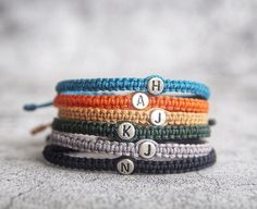 This listing is for ONLY 1 bracelets. D E T A I L S Material: High Quality 925 Sterling Silver initials . Charms available- A-Z, one bracelet one initial. This letter bracelet can also be made in a variety of color options. Choose your favorite color(s) ★Size ★ One size fits ( approx. 16 to 20 cm ). Please let us know if you think they are small or big for your wrists. ★ Shipping Time ★ United States, use USPS mail, will need 8 to 15 days arrive.  UK, France, Canada, Australia will use ordinary Handmade Sterling Silver Braided Friendship Bracelets, Personalized Silver Braided Bracelet Minimalist Style, Personalized Silver Braided Minimalist Bracelet, Bracelet Pour Couple, Bracelet Couples, Initial Charm Bracelet, Bracelet Initial, Couples Bracelet, Bracelet Couple